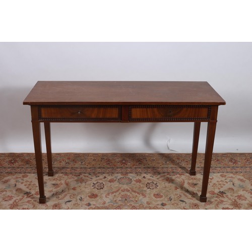 391 - A VINTAGE MAHOGANY SIDE TABLE of rectangular outline the shaped top with two frieze drawers on squar... 