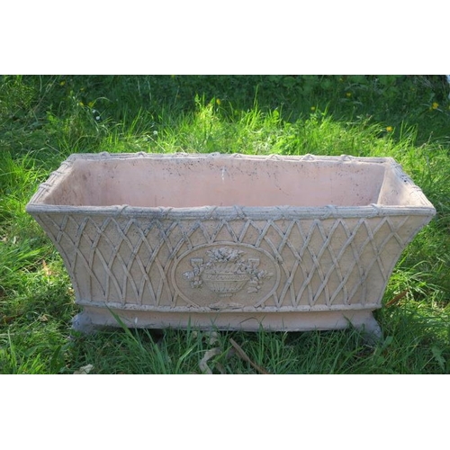 399 - A PAIR OF TERRACOTTA PLANTERS of rectangular tapering form the frieze with trellis work decoration c... 