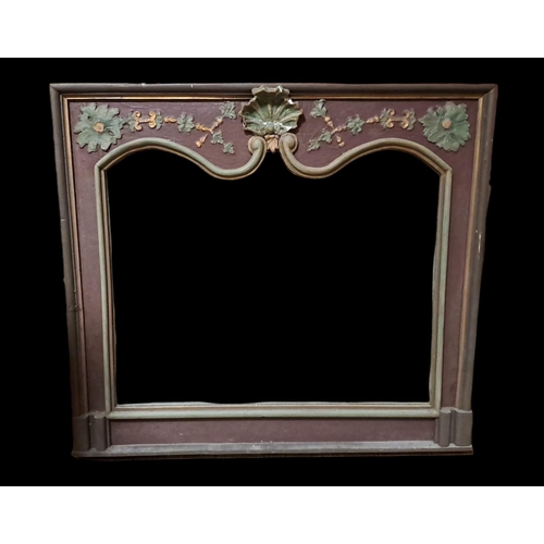 412 - A CONTINENTAL PINE AND PAINTED OVERMANTEL MIRROR the shaped plate within a moulded slip with shell, ... 