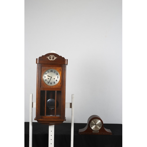 435 - A VINTAGE OAK DROP DIAL WALL CLOCK with circular silvered dial above glazed panels, a moulded apron ... 