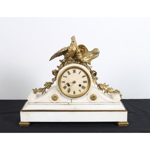 100 - A 19TH CENTURY WHITE MARBLE AND GILT BRASS MANTEL CLOCK the shaped case with circular dial and Roman... 