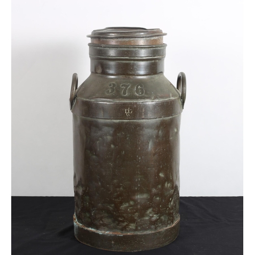 102 - A COPPER MILK CHURN of typical form with carrying handles bears serial number 376
56cm (h) x 26cm (w... 