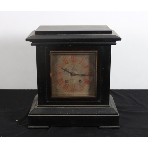 103 - A VINTAGE EBONISED CASED MANTEL CLOCK the rectangular case containing a silvered dial with Roman num... 