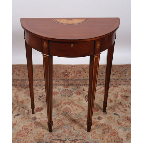 165 - A MAHOGANY INLAID SIDE TABLE of demi lune outline the shaped top with frieze drawer on square taperi... 