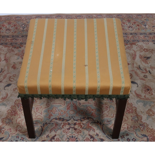 184 - A 19TH CENTURY MAHOGANY AND UPHOLSTERED STOOL the square upholstered seat above chamfered moulded le... 