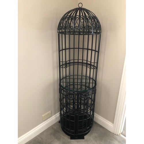 20 - A FREESTANDING WROUGHT IRON WINE BAR of cylindrical dome form with scroll decoration and glazed shel... 