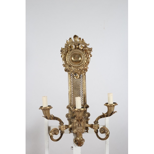 203 - A LARGE PAIR OF CONTINENTAL GILT BRASS THREE BRANCH WALL BRACKETS each with a mesh wirework backplat... 