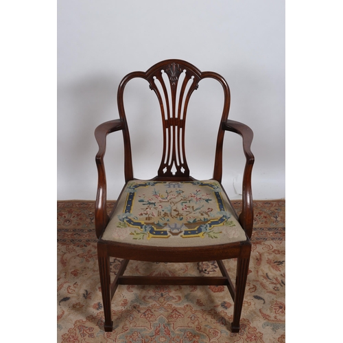 204 - A 19TH CENTURY HEPPLEWHITE STYLE MAHOGANY ELBOW CHAIR the shaped top rail with pierced vertical spla... 