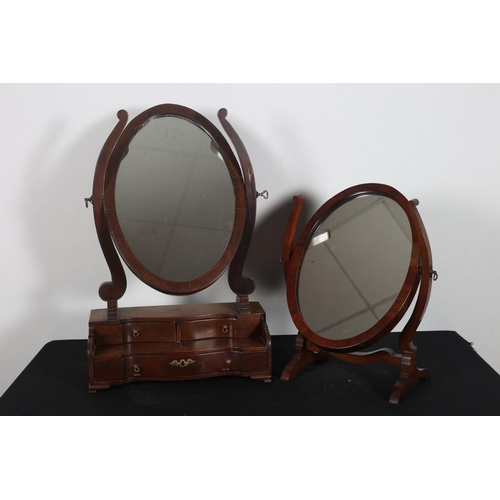 207 - A 19TH CENTURY MAHOGANY CRUTCH FRAME MIRROR the oval plate within a moulded frame with shaped suppor... 