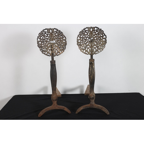 209 - A PAIR OF 19TH CENTURY BRASS AND STEEL ANDIRONS each with a rectangular column with pierced foliate ... 