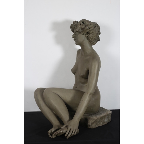 210 - ROBIN BUICK 
A composition figure modelled as a naked female shown seated on a rockwork base 
92cm (... 