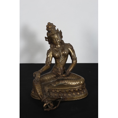 218 - A CHINESE BRONZE SCULPTURE modelled as a deity shown seated on an oval base 
30cm (h) x 25cm (w) x 2... 