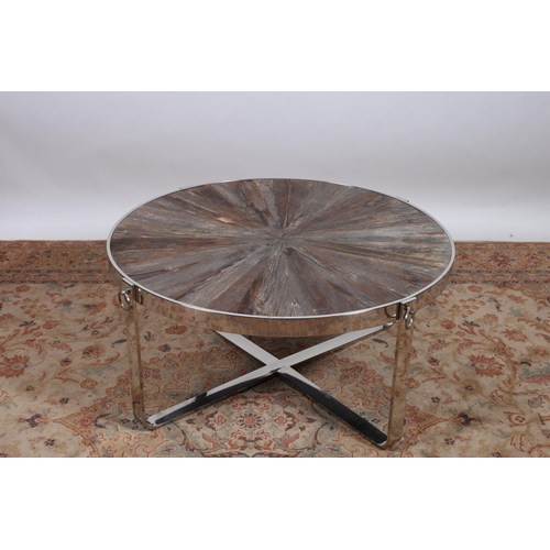 221 - A DESIGNER CHROME AND HARDWOOD COFFEE TABLE the circular shaped top with segmented inlaid panels rai... 