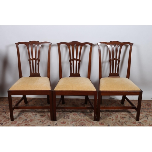 223 - A SET OF THREE GEORGIAN STYLE MAHOGANY DINING CHAIRS each with a shaped top rail above a pierced ver... 