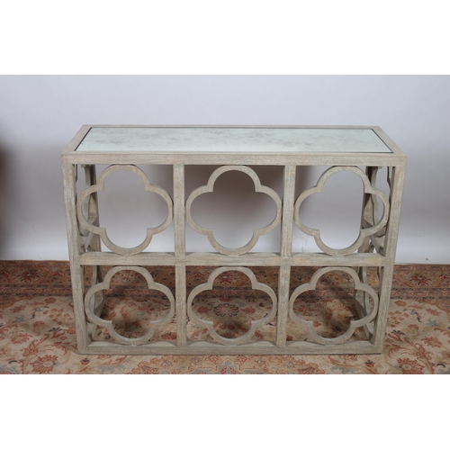 258 - A SHABBY CHIC LIMED WOOD CONSOLE TABLE of rectangular outline the shaped top with mirrored inset on ... 