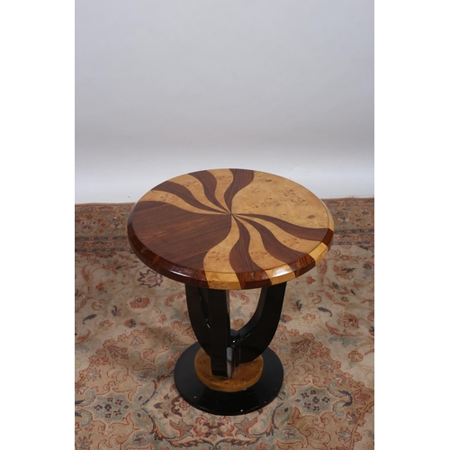 261 - AN ART DECO STYLE ROSEWOOD WALNUT AND EBONISED OCCASIONAL TABLE of circular outline the shaped top r... 