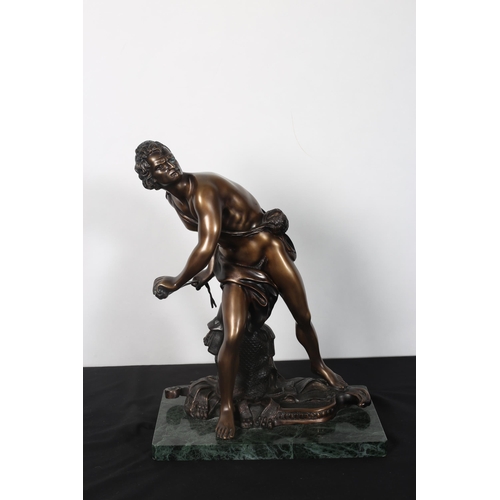 265 - after GIAN LORENZO BERNINI
A bronze figure modelled as David shown standing holding a sling raised o... 