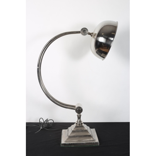 268 - A 1960s CHROME TABLE LAMP with adjustable arm and dome shade raised on a square stepped base
85cm (h... 