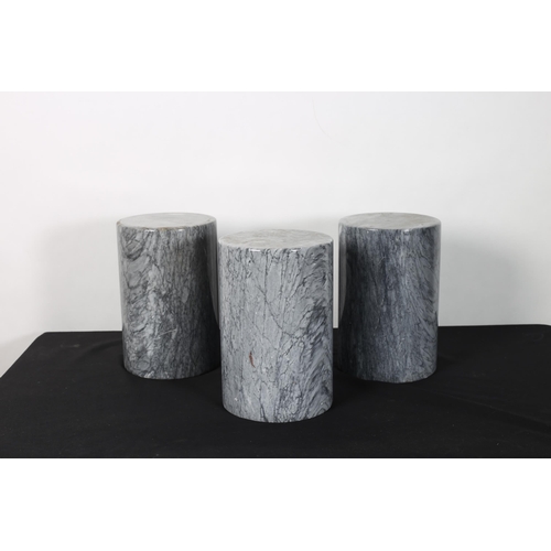 269 - A SET OF THREE GREY VEINED MARBLE PEDESTALS each of cylindrical outline 
30cm (h) x 20cm (d)