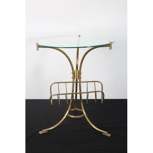 272 - A CONTINENTAL GILT BRASS AND GLAZED COFFEE TABLE the circular glazed top raised on tubular splayed s... 