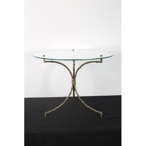 281 - A CONTINENTAL GILT BRASS AND GLAZED COFFEE TABLE the circular glass top raised on simulated bamboo s... 