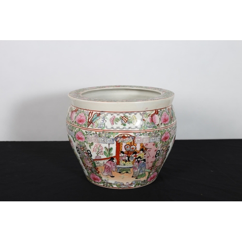 303 - A CHINESE FAMILLE ROSE JARDINIERE of cylindrical tapering form the white ground decorated with flowe... 