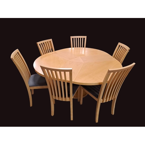 317 - A DESIGNER BEECHWOOD SEVEN PIECE BREAKFAST SUITE comprising six dining chairs each with a curved top... 