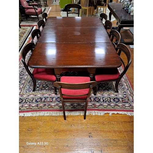 318 - A 19TH CENTURY ELEVEN PIECE MAHOGANY DINING ROOM SUITE comprising ten chairs each with a curved top ... 