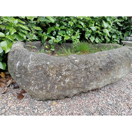 333 - A SANDSTONE TROUGH of oval outline 
40cm (h) x 120cm (w) x 74cm (d)