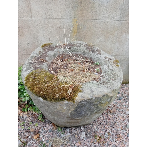 334 - A SANDSTONE TROUGH of cylindrical tapering form 
50cm (h) x 60cm (d)