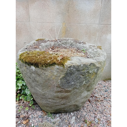 334 - A SANDSTONE TROUGH of cylindrical tapering form 
50cm (h) x 60cm (d)