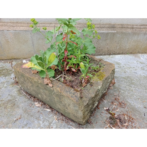 335 - A SANDSTONE TROUGH of rectangular outline 
17cm (h) x 39cm (w) x 37cm (d)