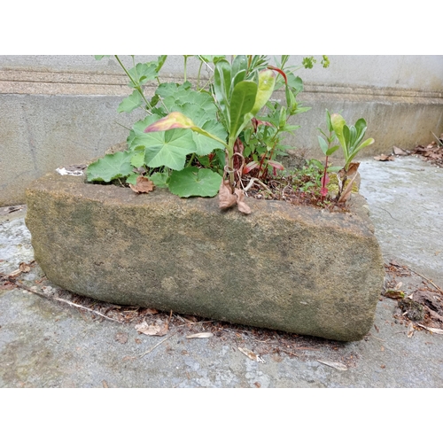 335 - A SANDSTONE TROUGH of rectangular outline 
17cm (h) x 39cm (w) x 37cm (d)