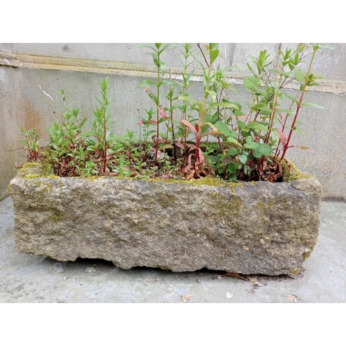 336 - A SANDSTONE TROUGH of rectangular outline 
18cm (h) x 55cm (w) x 33cm (d)