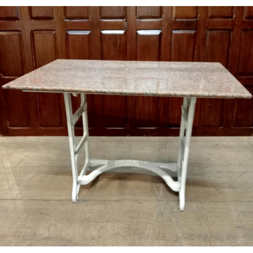 339 - A TAYWILL CAST IRON AND MARBLE TABLE the rectangular pink veined marble top raised on end stand supp... 