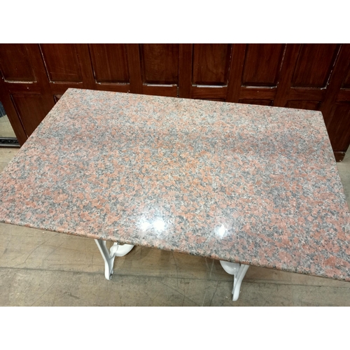 339 - A TAYWILL CAST IRON AND MARBLE TABLE the rectangular pink veined marble top raised on end stand supp... 