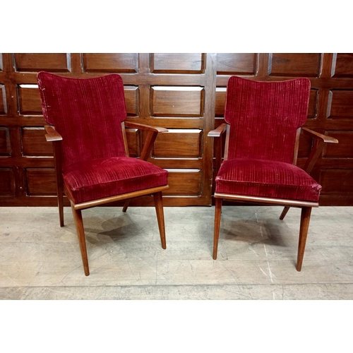 340 - A PAIR OF VINTAGE TEAK AND UPHOLSTERED ELBOW CHAIRS each with a shaped upholstered back and seat wit... 