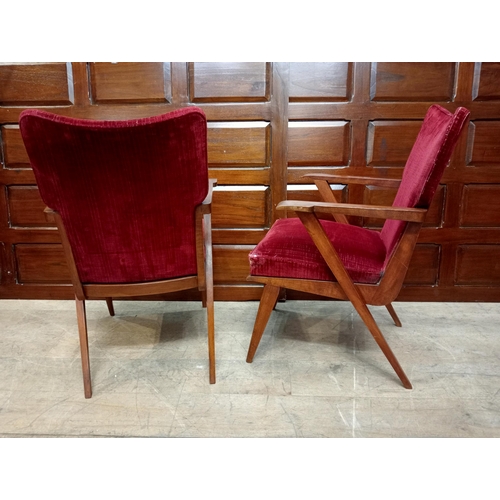 340 - A PAIR OF VINTAGE TEAK AND UPHOLSTERED ELBOW CHAIRS each with a shaped upholstered back and seat wit... 