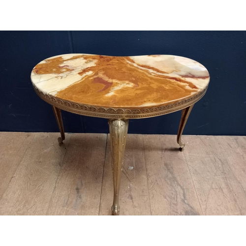 342 - AN ONYX AND GILT BRASS COFFEE TABLE of kidney shaped outline the shaped top on cabriole legs with sc... 