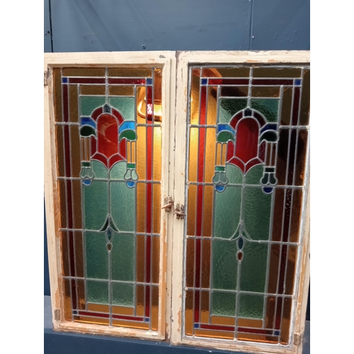 345 - A FINE PAIR OF VINTAGE CAST IRON LEAD GLASS AND COLOURED GLASS HINGED WINDOWS each of rectangular fo... 