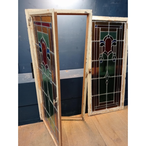 345 - A FINE PAIR OF VINTAGE CAST IRON LEAD GLASS AND COLOURED GLASS HINGED WINDOWS each of rectangular fo... 