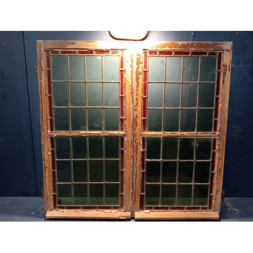 346 - A PAIR OF VINTAGE PINE LEAD GLASS AND COLOURED GLASS WINDOWS each of rectangular form with brass hin... 