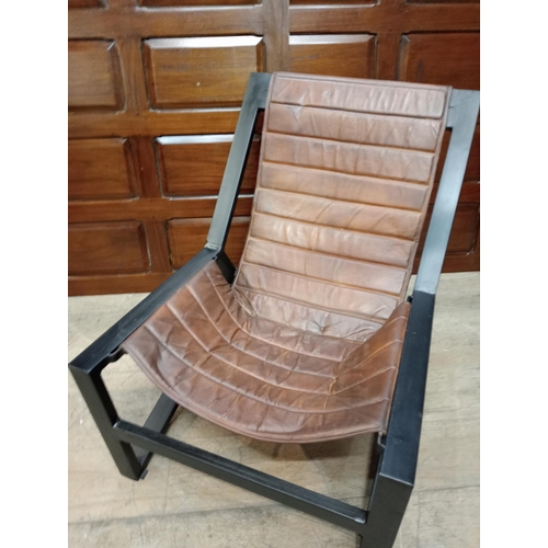 361 - A METAL AND LEATHER LOUNGE CHAIR the rectangular shaped frame with ribbed leather back and seat on t... 