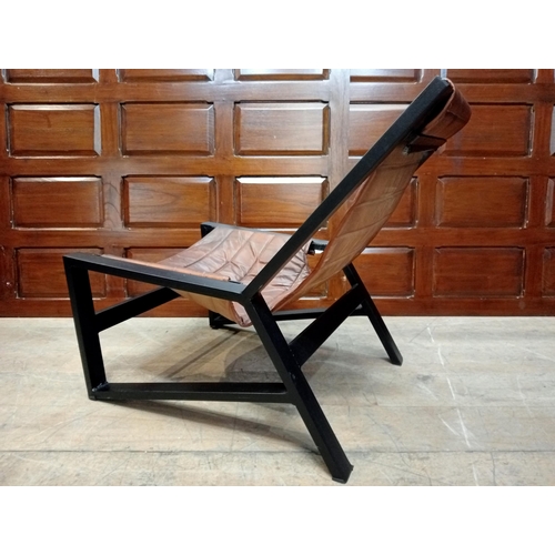 361 - A METAL AND LEATHER LOUNGE CHAIR the rectangular shaped frame with ribbed leather back and seat on t... 