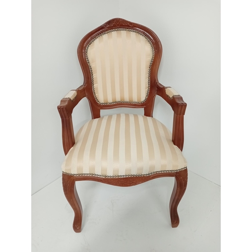 362 - A CONTINENTAL STAINED BEECHWOOD AND UPHOLSTERED ELBOW CHAIR the shaped top rail with upholstered pan... 