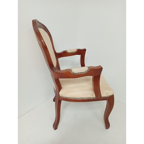 362 - A CONTINENTAL STAINED BEECHWOOD AND UPHOLSTERED ELBOW CHAIR the shaped top rail with upholstered pan... 