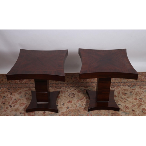 401 - GIORGIO COLLECTION 
A pair of simulated rosewood end tables each of rectangular concave outline the ... 