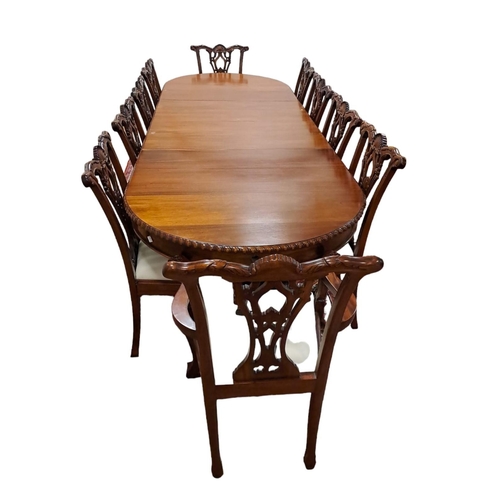 42 - AN ELEVEN PIECE MAHOGANY CHIPPENDALE DESIGN DINING ROOM SUITE comprising ten chairs, including a pai... 