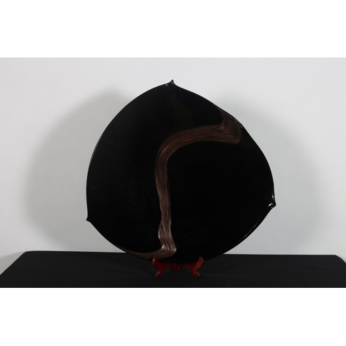 421 - A VENETIAN MURANO BLACK BLOW GLASS PLATE with gold leaf of irregular outline 
60cm (h) x 62cm (w)