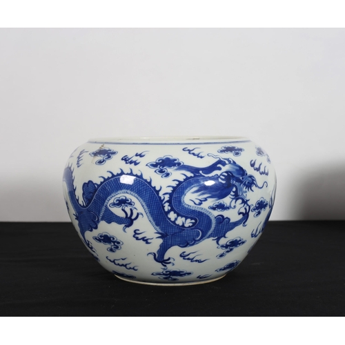 427 - A CHINESE BLUE AND WHITE BOWL of ovoid tapering form the white ground decorated with dragons
7cm (h)